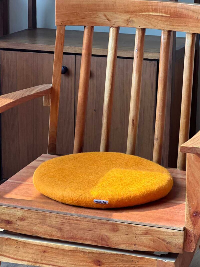 yellow round chair pad