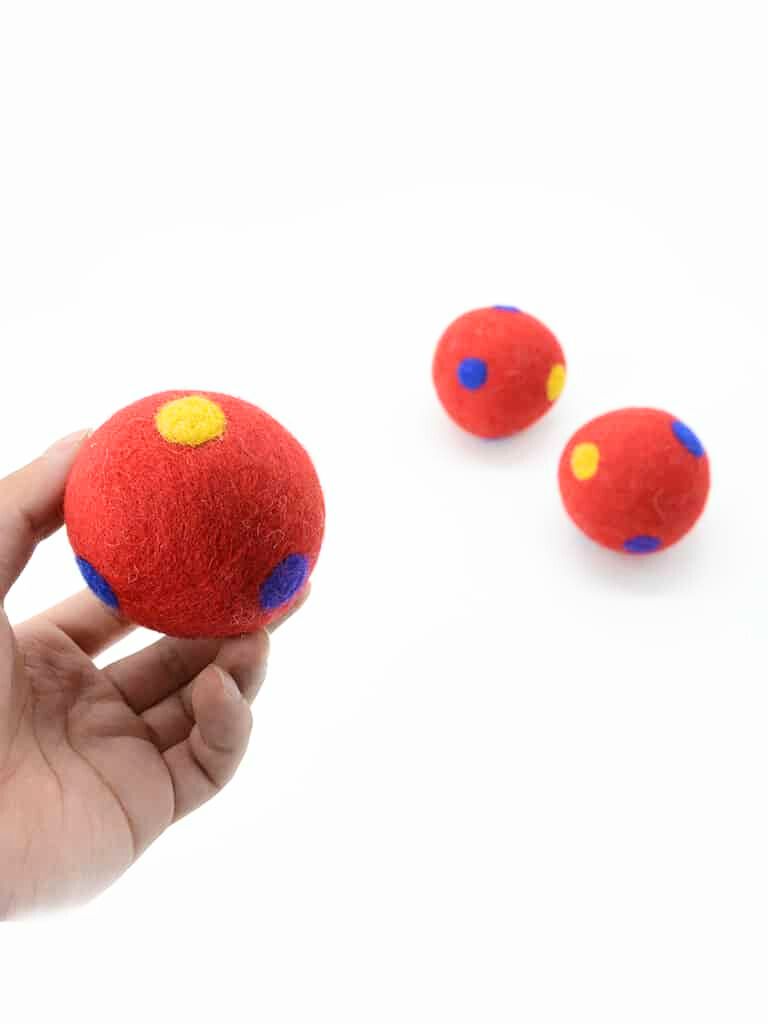 3cm red felt balls with polka dots, ready to be strung, glued, or stitched into countless creative adventures