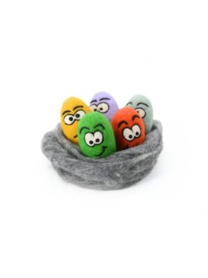 Winking from beneath a floral crown, this handmade felt Easter egg brings a mischievous smile to your Easter celebration