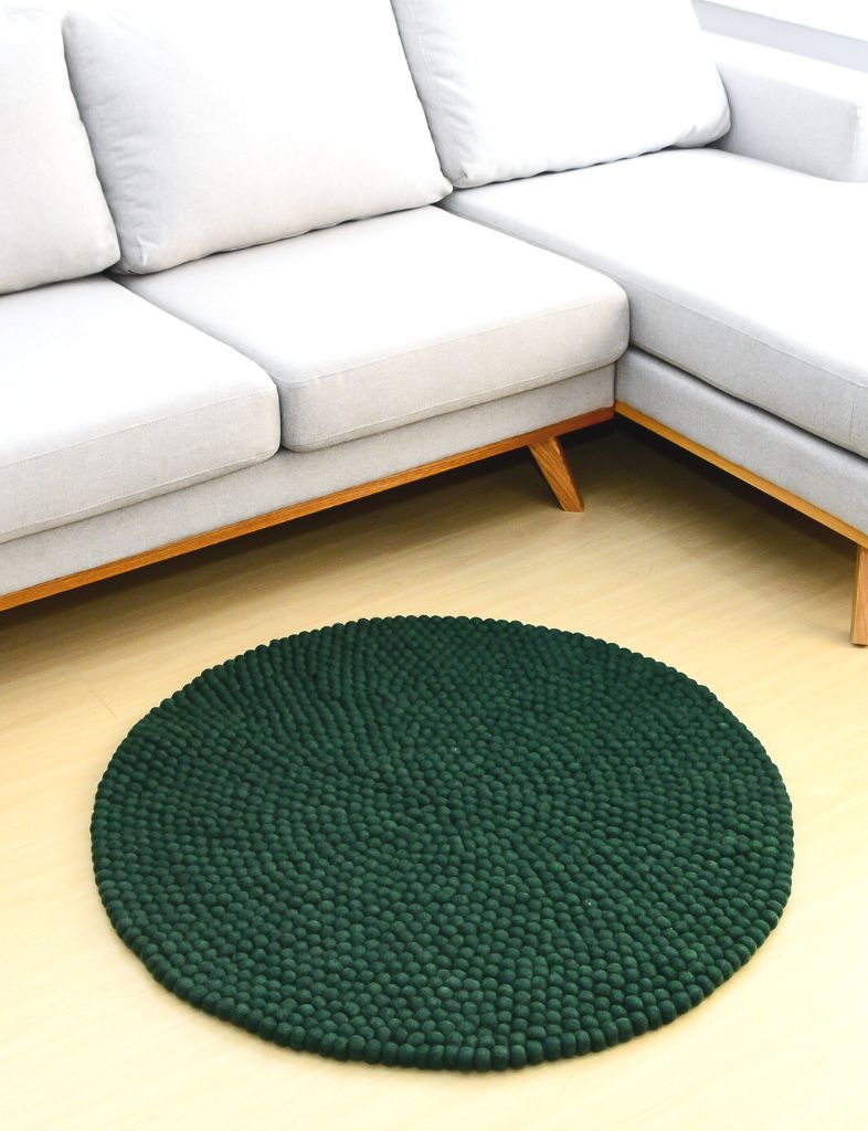 handmade wool felt ball rug in dark green