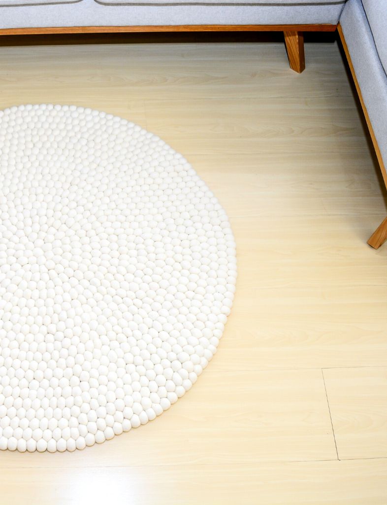round white handmade felt ball rug