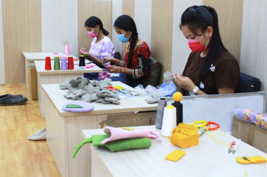 women making handmade felt crafts 